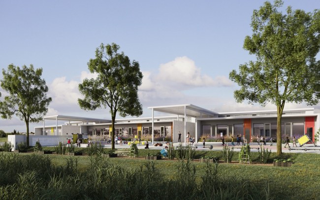 groupe scolaire Saint-Geniès-de-Fontedit : Une cour faisant face à la nature, devant la façade animée par un jeu de volumes, couleurs et protections solaires.