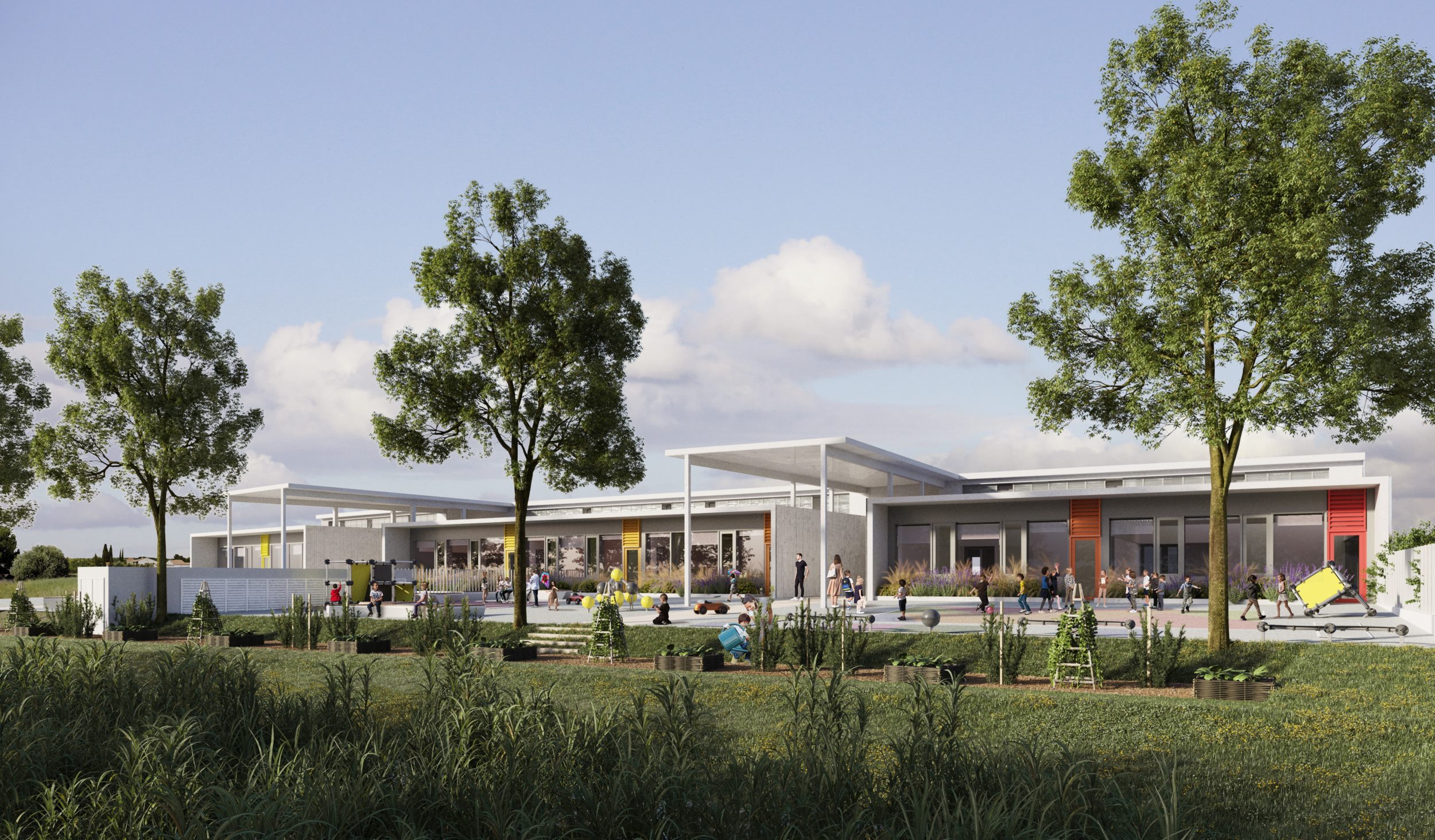 groupe scolaire Saint-Geniès-de-Fontedit : Une cour faisant face à la nature, devant la façade animée par un jeu de volumes, couleurs et protections solaires.